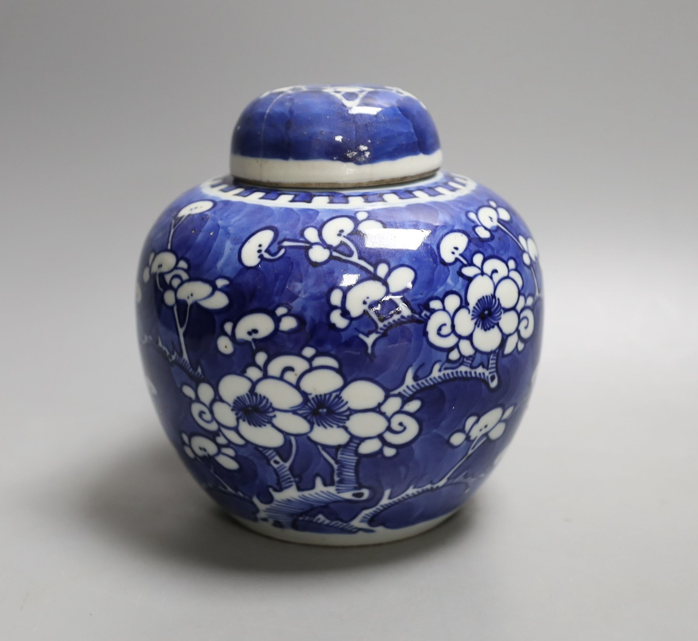 A Chinese blue and white jar and cover, Kangxi mark and of the period, 15cm tall